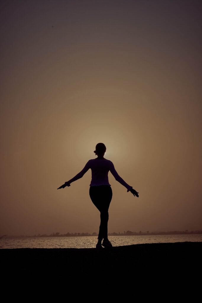 Person standing confidently with an open posture
