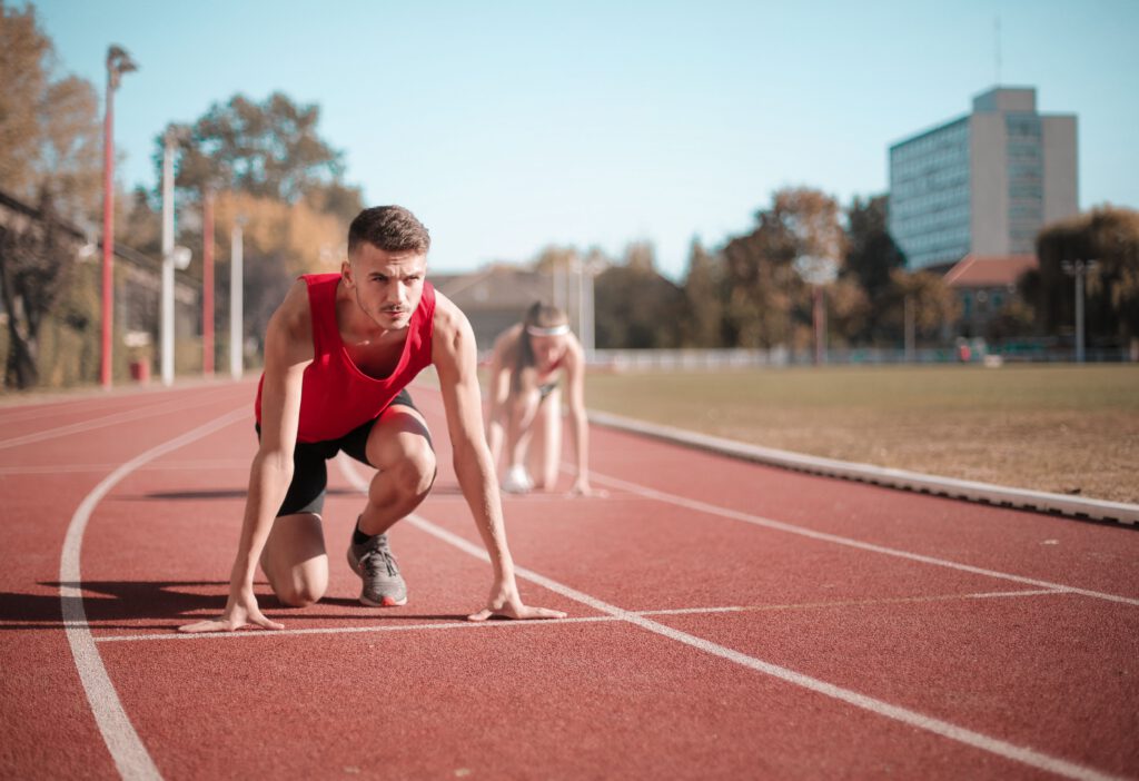 Runner preparing to start on an athletics track