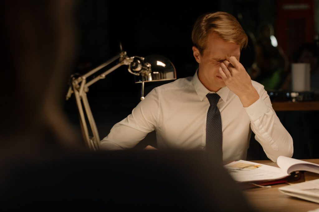 Stressed professional at work representing a common smoking trigger