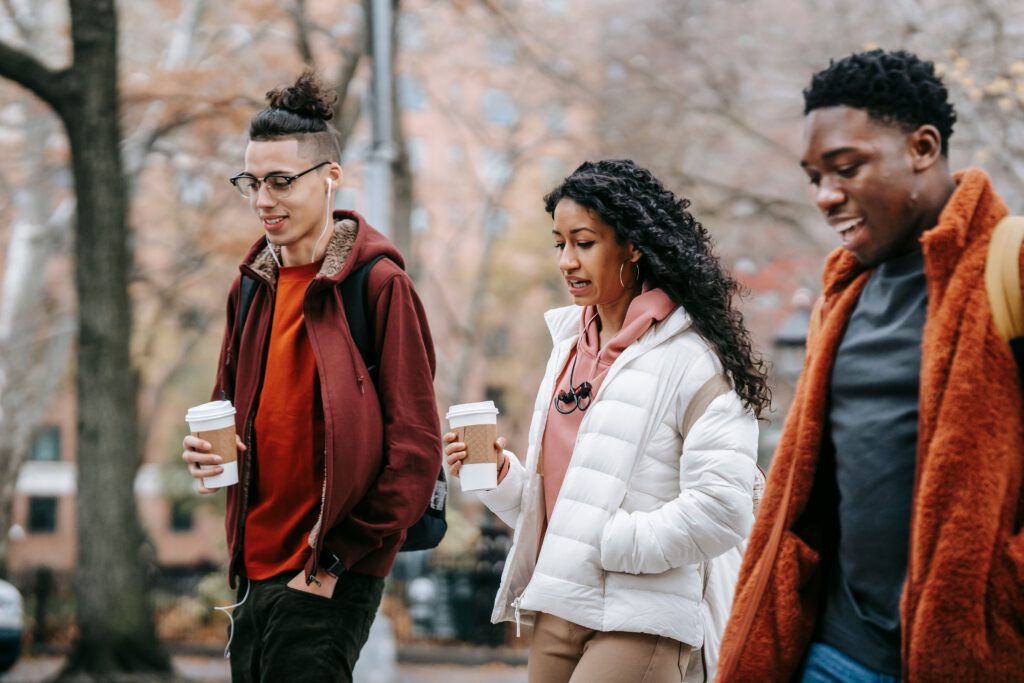 Friends walking together enjoying everyday life without cigarettes