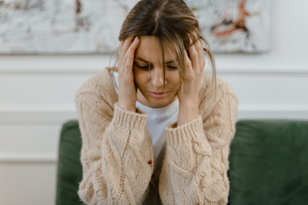 Woman experiencing stress and emotional overwhelm