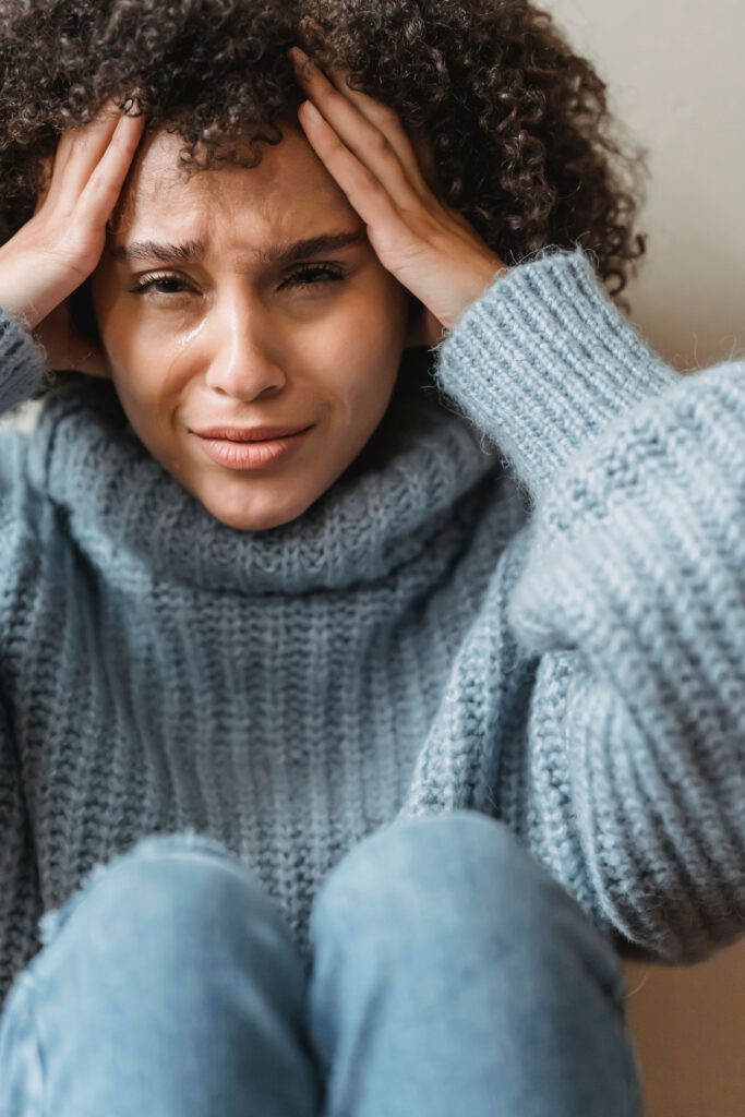 Woman feeling overwhelmed by stress and anxious thoughts