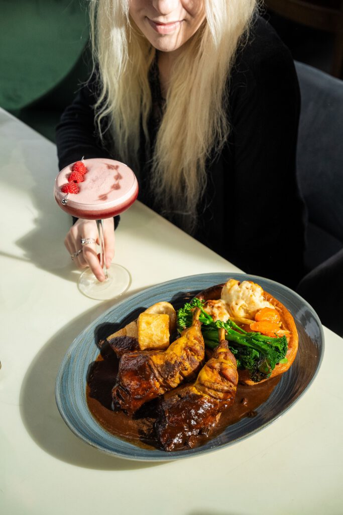 Woman enjoying a meal representing a calmer relationship with food